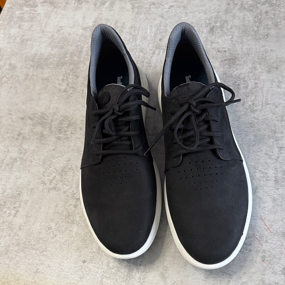 Timberland Black Sneakers with White Sole. new without tags